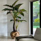 Planta artificial grande de "Alocacia" con maceta incluida.