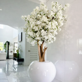 Planta artificial grande "White Erlis" con maceta incluida.