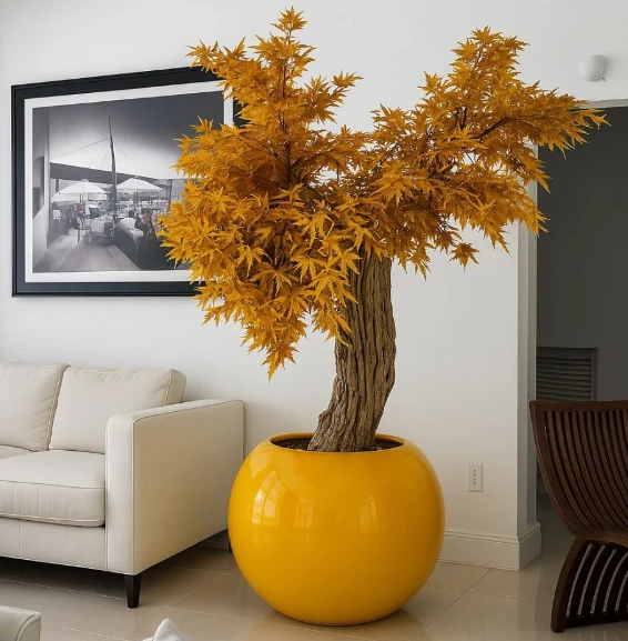 Planta artificial grande "Exclue" con maceta incluida.