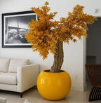 Planta artificial grande "Exclue" con maceta incluida.