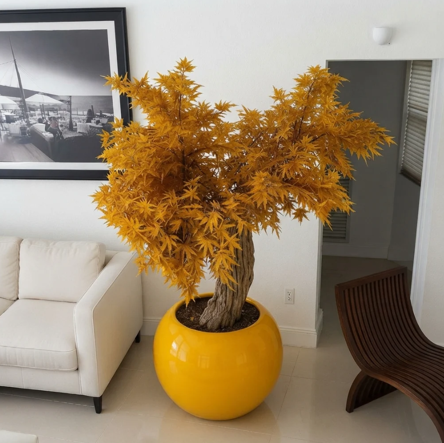 Planta artificial grande "Exclue" con maceta incluida.